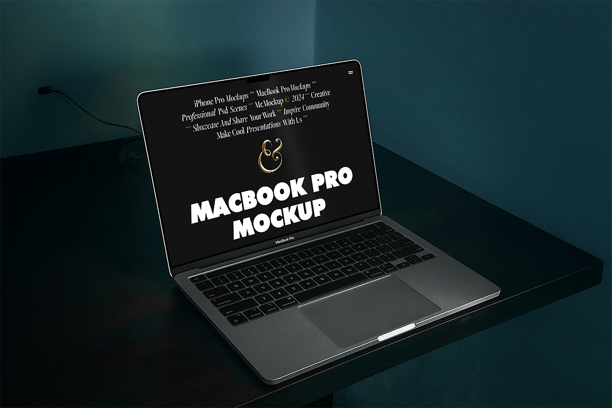 黑色桌子上的MacBook Pro样机插图