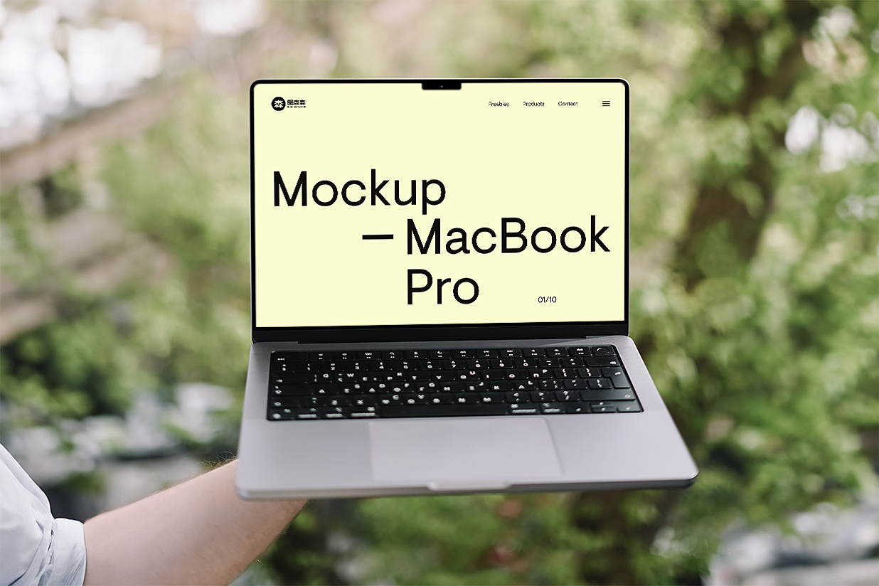手持MacBook Pro样机插图