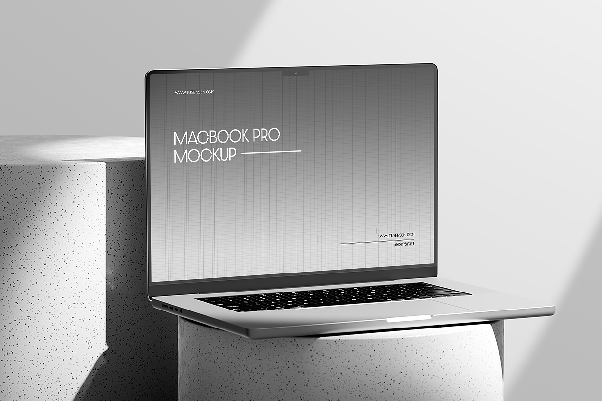 圆形石头上的Macbook Pro样机插图