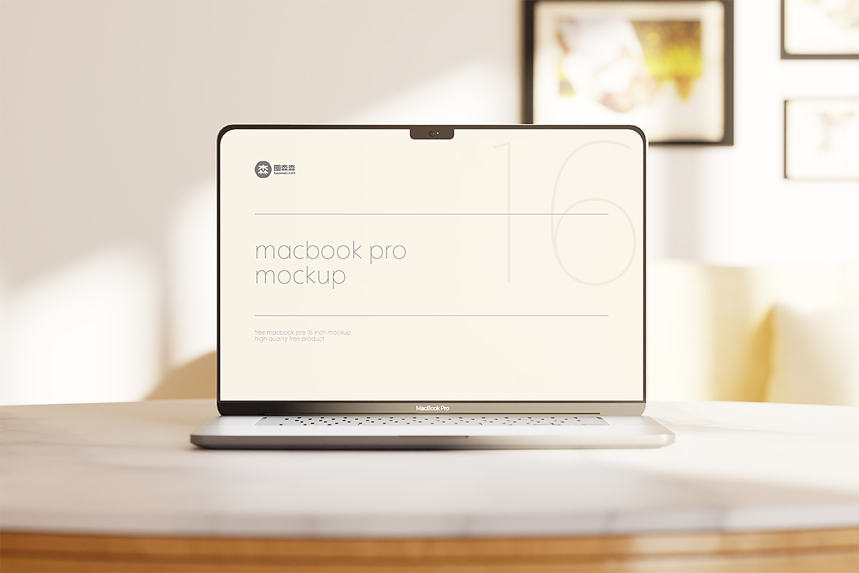 在圆桌上的Macbook Pro样机3组插图1