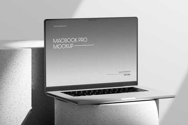 圆形石头上的Macbook Pro样机