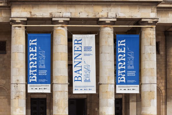 悬挂在建筑上的吊旗挂旗广告旗样机Mockup